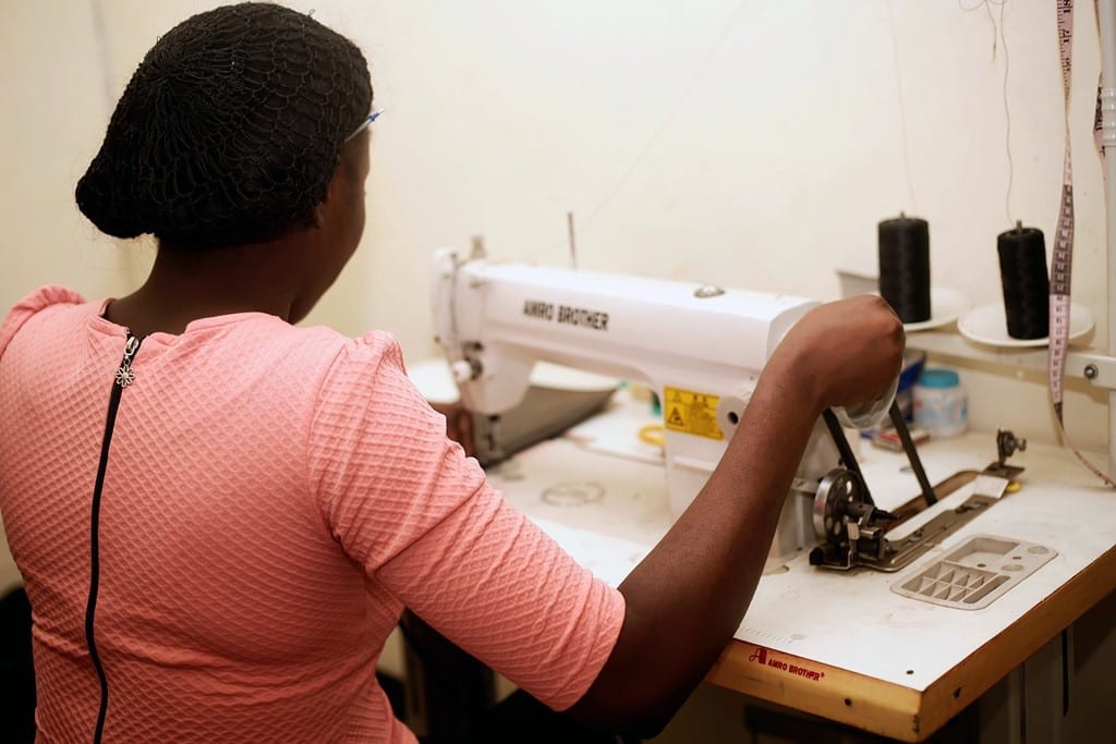 seamstress with sewing machine