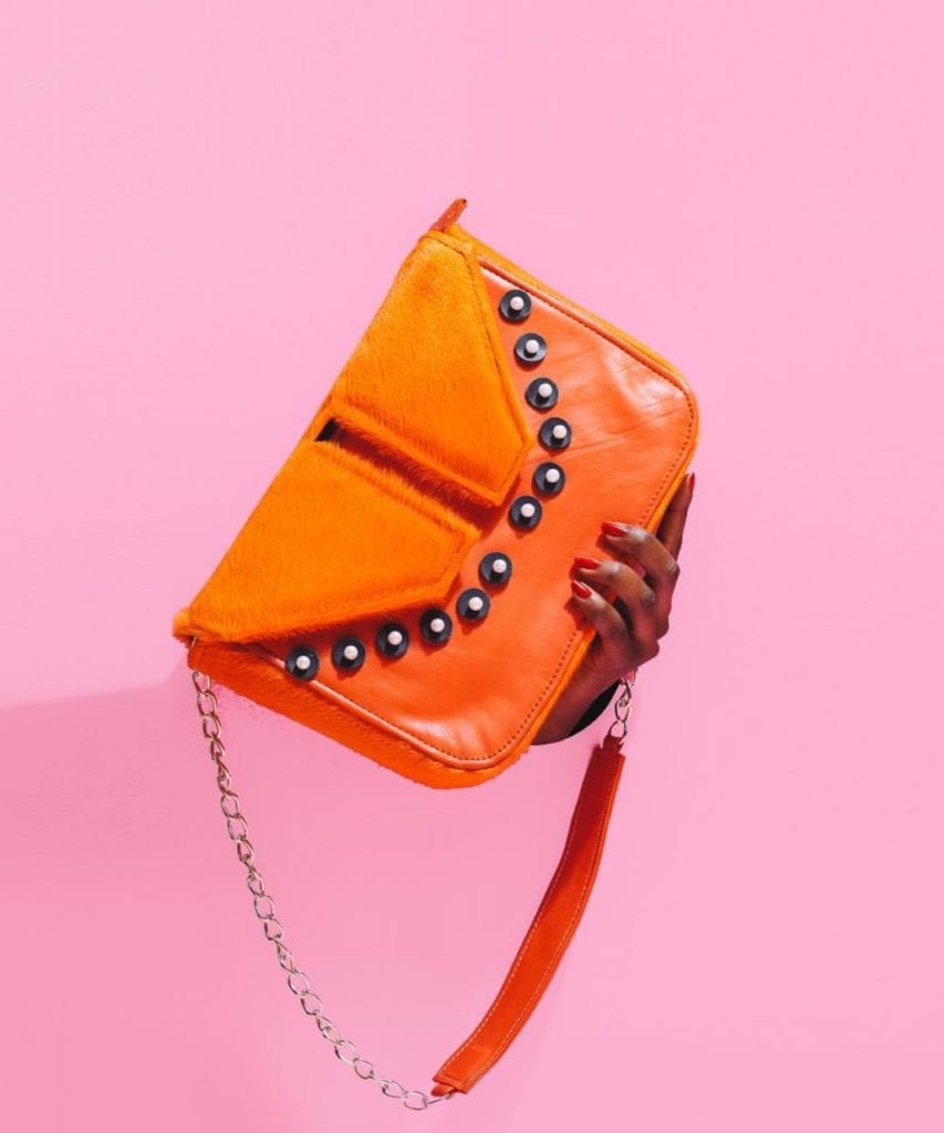 orange bag against pink background