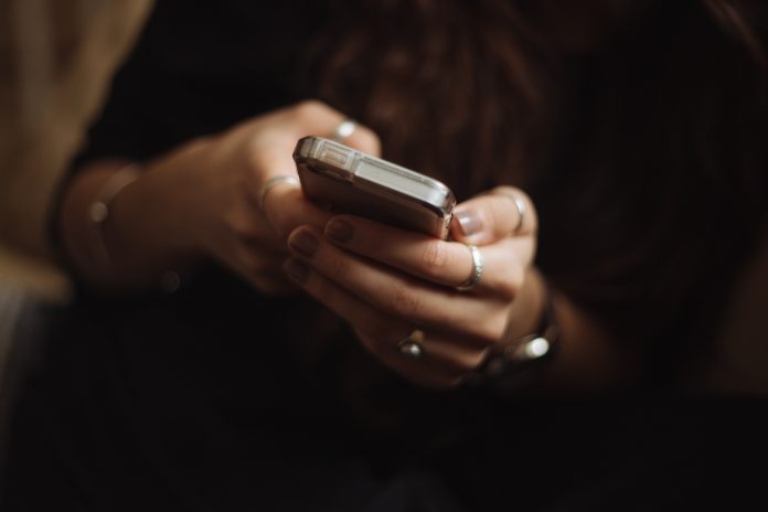 a woman using a mobile phone