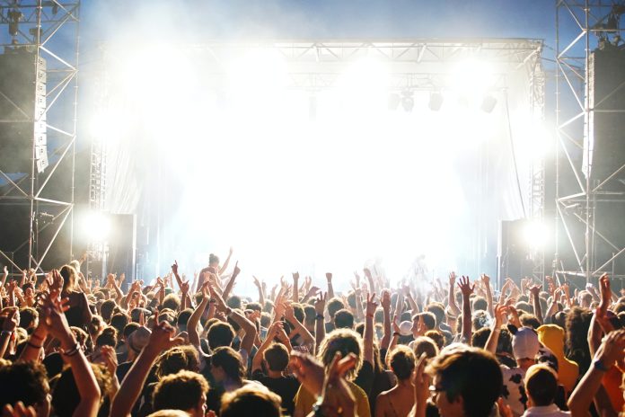 People standing beside a stage