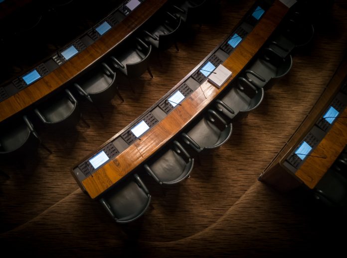 Desks and chairs in a political meeting room