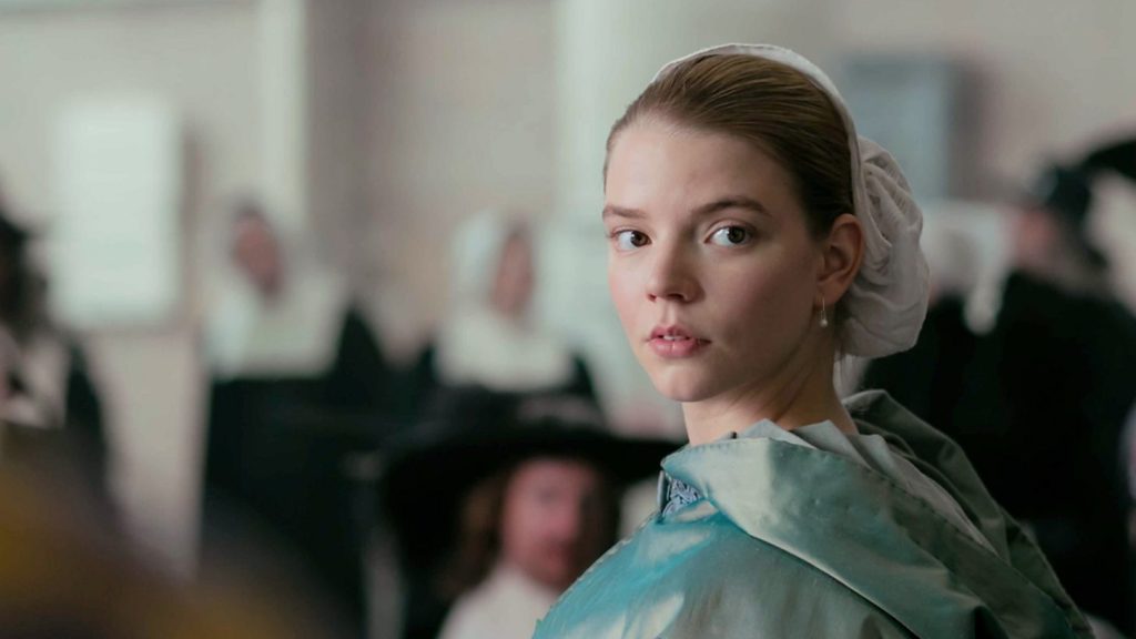 Anya Taylor-Joy as Nella in 'The Miniaturist', looking over her shoulder.